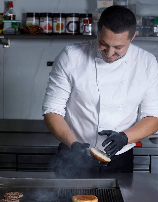 Our chef preparing a dish in the kitchen